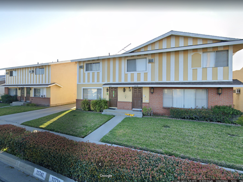 A building with a yellow and white striped facade.