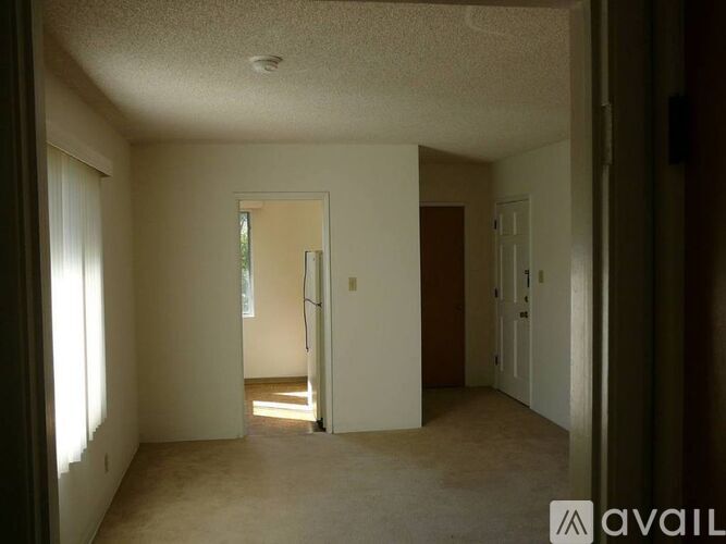 A room with a door and a window.