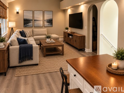 A kitchen with a refrigerator, microwave, and oven.