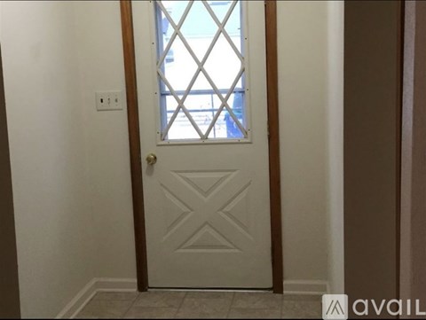A white door with a diamond pattern on it.
