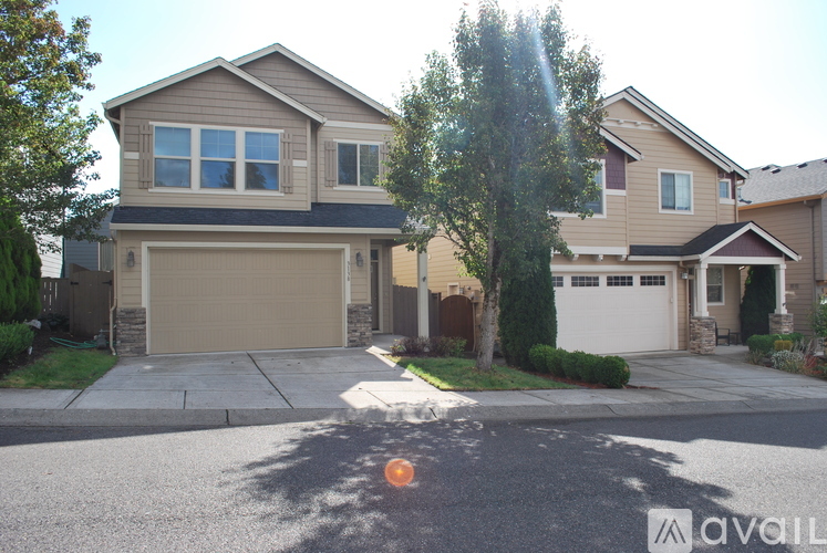A house with a garage is for sale.