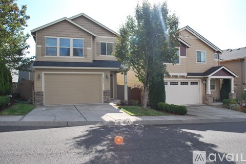 A house with a garage is for sale.