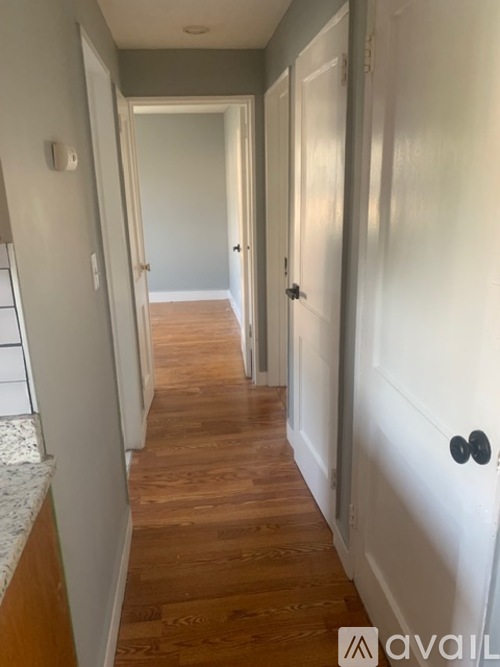 A long hallway with doors on both sides.