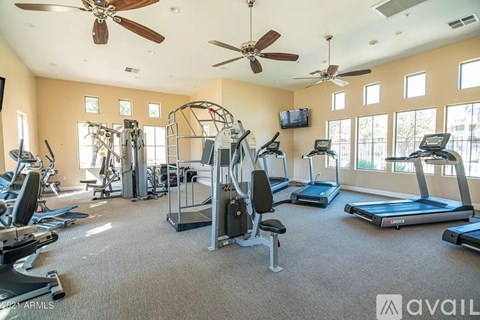 A well-equipped gym with treadmills, exercise bikes, and other fitness machines.