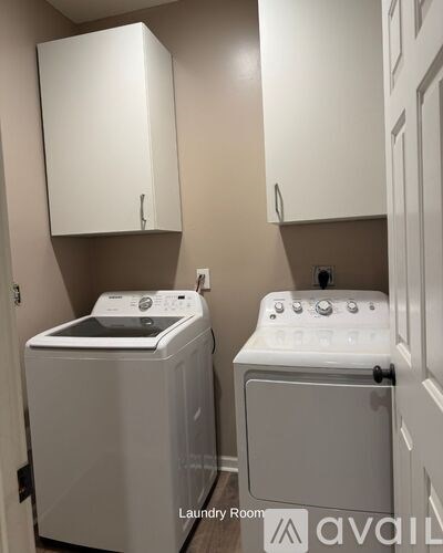 A laundry room with a washer and dryer.