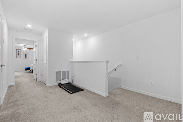 A spacious room with a bed and a radiator on the wall.
