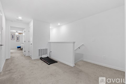 A spacious room with a bed and a radiator on the wall.