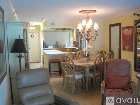 A dining room with a table set for six.