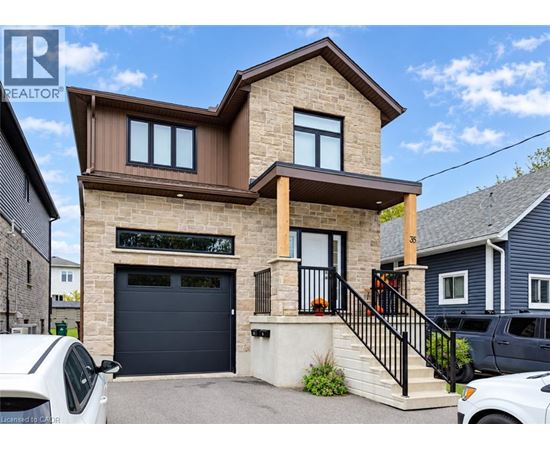 A modern house with a garage is for sale.