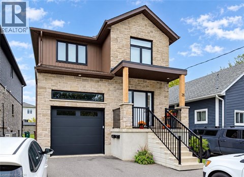A modern house with a garage is for sale.