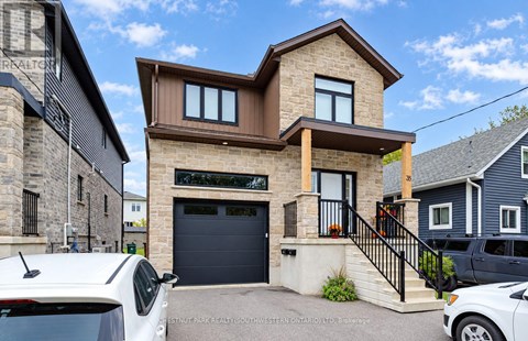 A modern house with a garage is for sale.