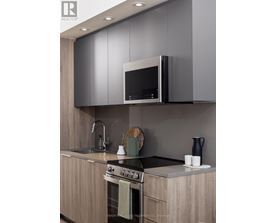 A modern kitchen with a stove top oven and a microwave above it.