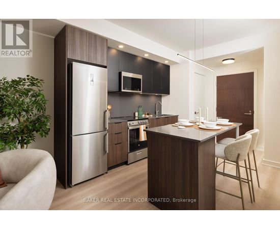 A modern kitchen with a dining table and chairs.