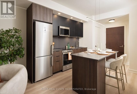 A modern kitchen with a dining table and chairs.