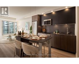 A modern kitchen with a dining table set for two.