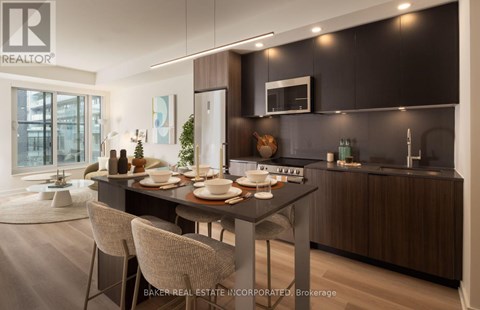 A modern kitchen with a dining table set for two.