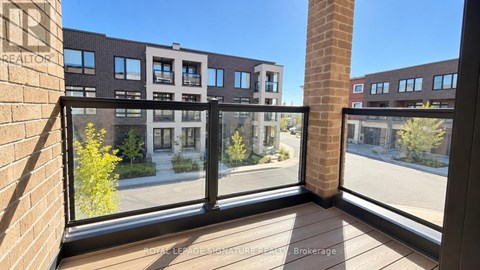 A view from a window of a building with a sign that says Brokerage.