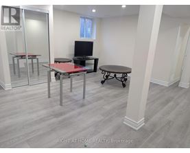 A room with a table and chairs in it.