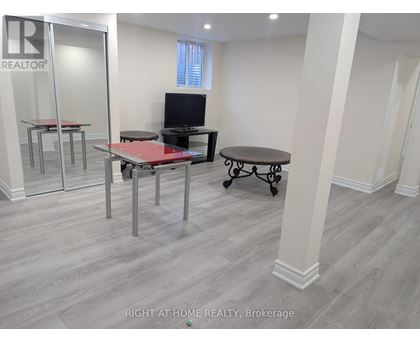 A room with a table and chairs in it.