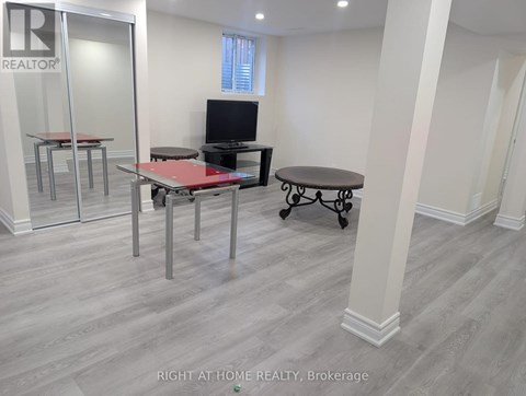 A room with a table and chairs in it.