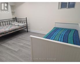 A bedroom with a bed and a bunk bed.