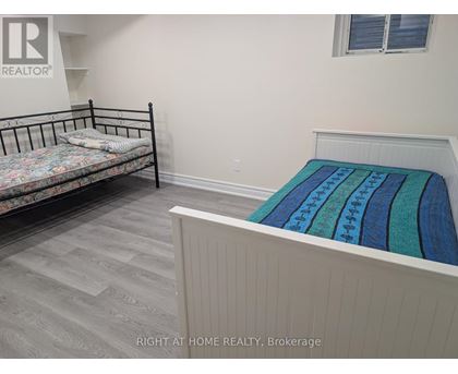 A bedroom with a bed and a bunk bed.