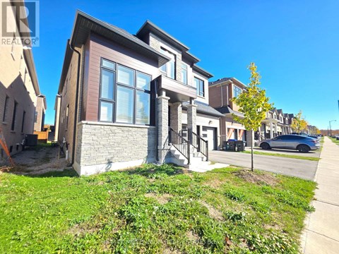 A modern house with a brown and beige exterior is shown.