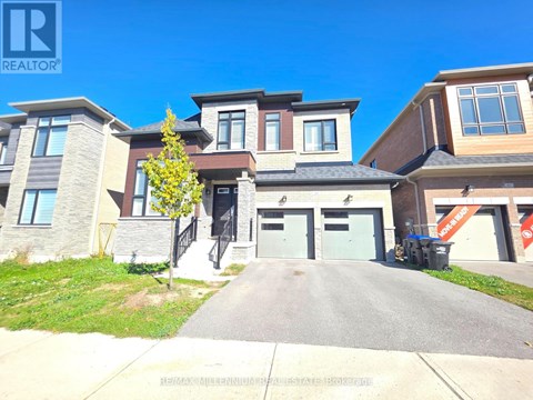A realtor logo is displayed in the upper left corner of a photo showing a row of houses.