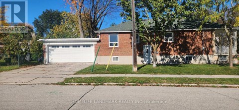 A house with a garage is for sale.