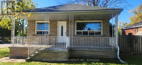 A small house with a porch and a sign that says "Homelife Landmark Realty Inc., Brokerage.".