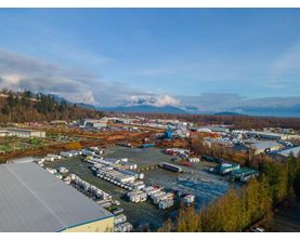 A large industrial area with a parking lot and buildings.