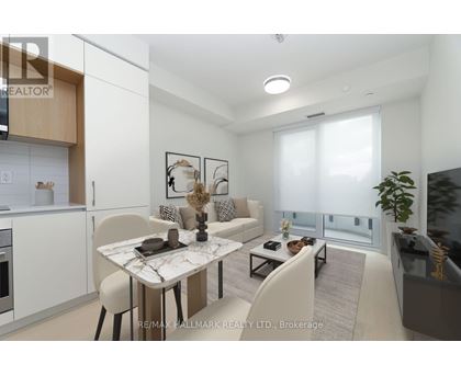 A modern living room with a dining table and chairs.
