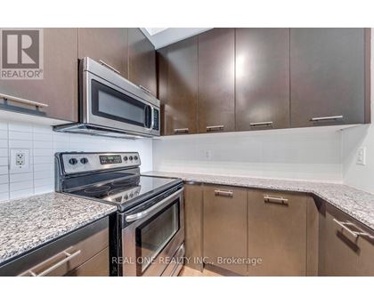 A kitchen with a stove top oven and microwave above it.
