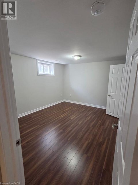 A room with wooden floors and white walls.