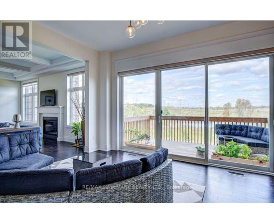 A living room with a couch and a television.