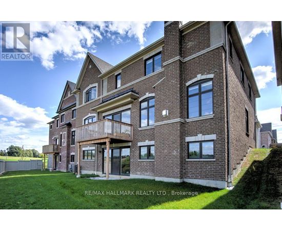A large brick building with a balcony on the second floor.