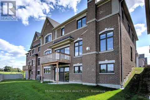 A large brick building with a balcony on the second floor.