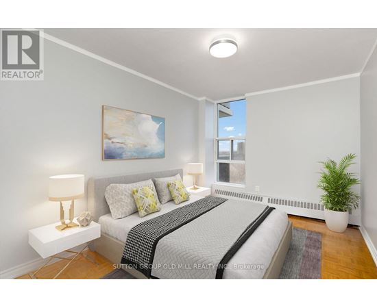 A bedroom with a bed, nightstands, and a painting on the wall.