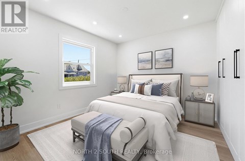 A bedroom with a large bed and a potted plant.