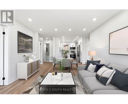 A modern living room with a grey sofa and a coffee table.