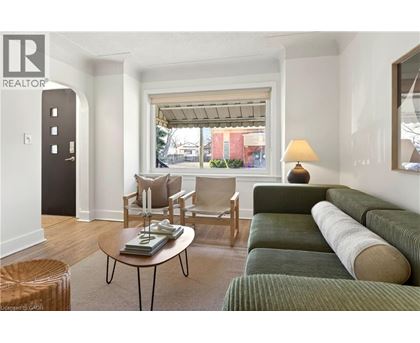 A living room with a green couch and a coffee table.