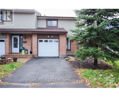 A house with a white garage door is for sale.