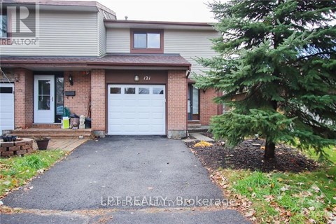 A house with a white garage door is for sale.
