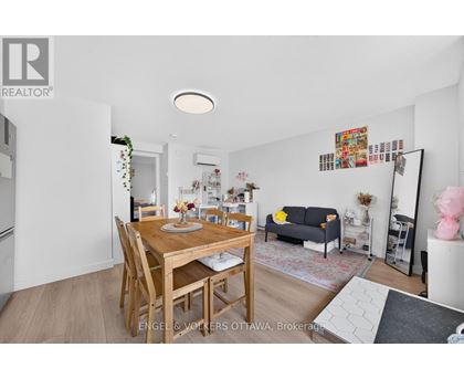 A dining room with a wooden table and chairs.