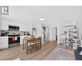 A kitchen with a table and chairs in the middle of the room.