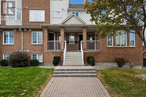 A brick building with a sign that says REALTOR on the top left.