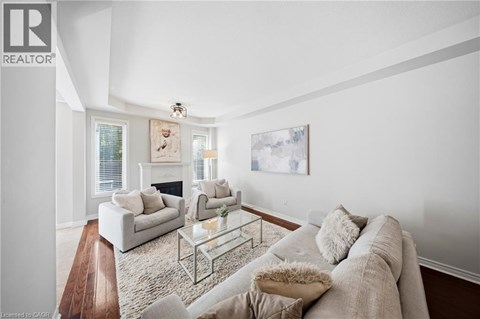 A living room with a grey couch and a coffee table.