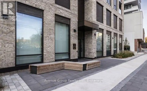 A building with the text "Avenue Group Realty, Inc., Brokerage" on the bottom.