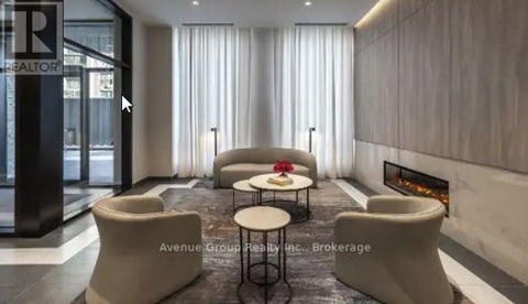 A modern living room with a fireplace and a dining table.