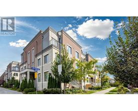 A modern apartment building with a clear blue sky above.